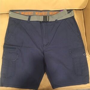Stretch waistband, 98% cotton,2% spandex. Navy blue cargo shorts with grey belt.